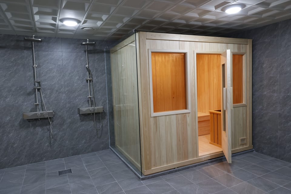 Separate tub and shower, deep soaking tub, rainfall showerhead, towels