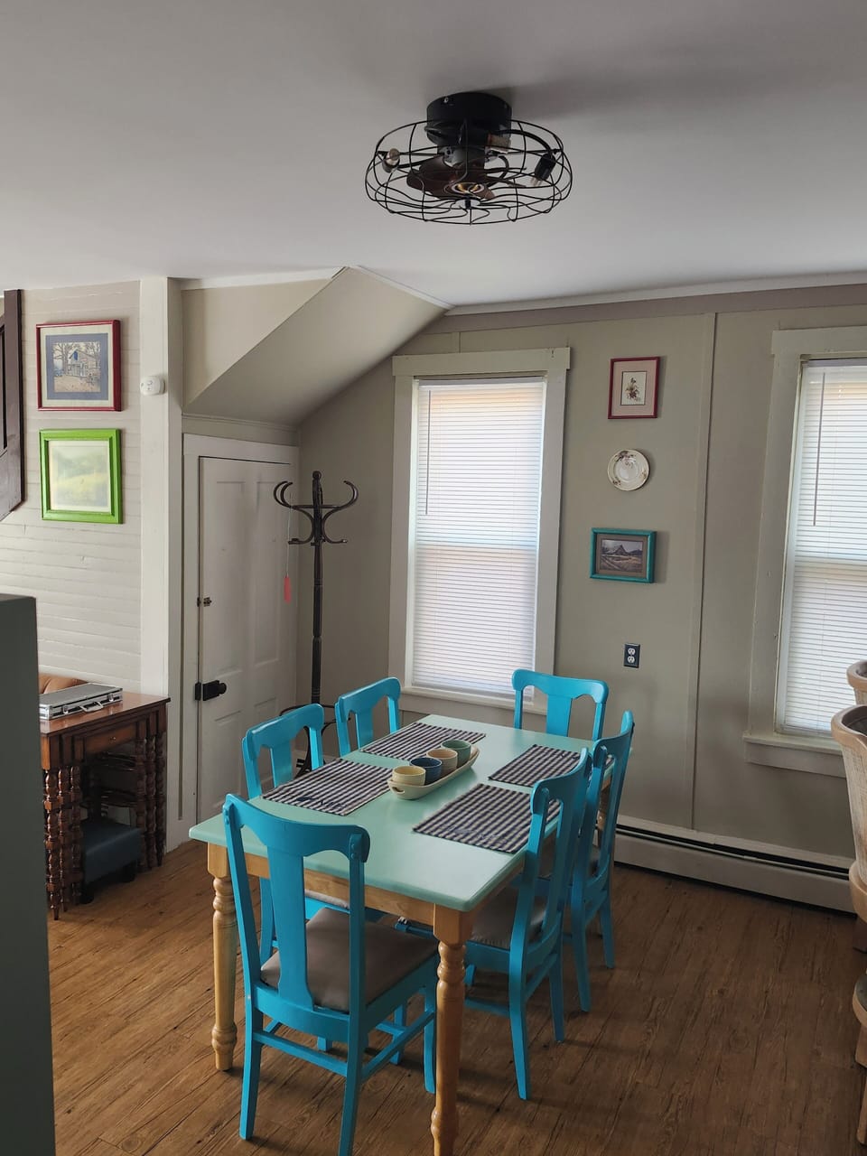 kitchen table, setting for six, extra chairs are provided in the closet