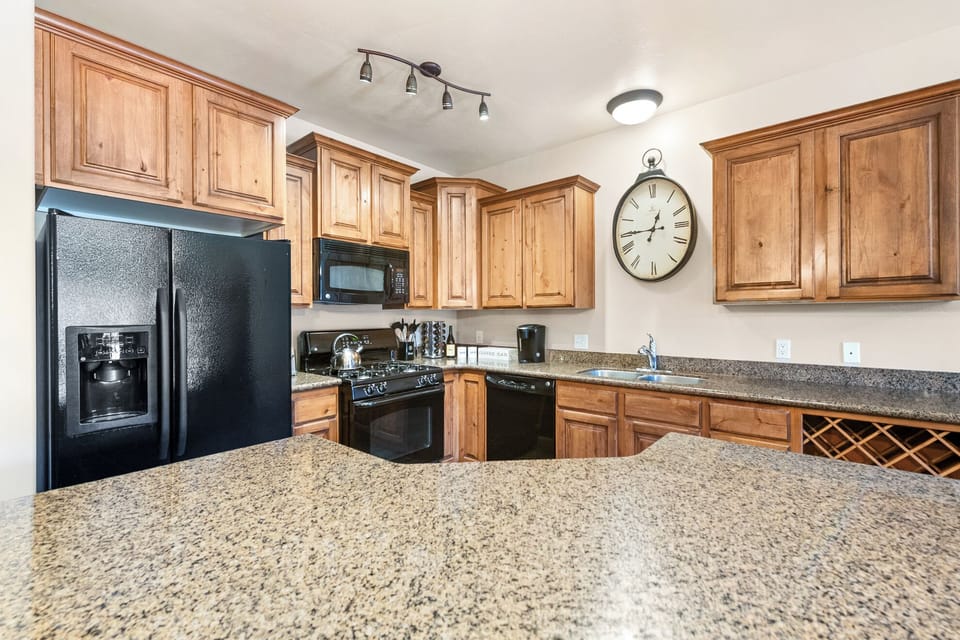 The well-appointed kitchen offers granite countertops, full-size appliances, ample cabinetry, and everything you need to prepare meals during your stay.