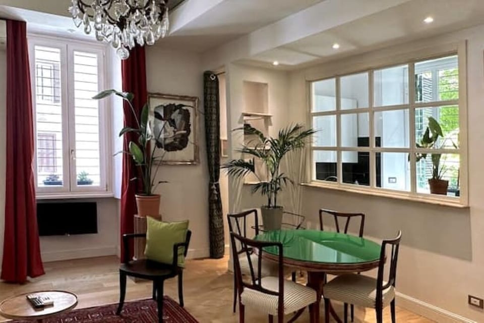 Living room with dining table and two single sofa beds