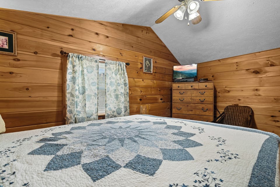 Bed 3: Upper level queen with TV and ensuite full bath