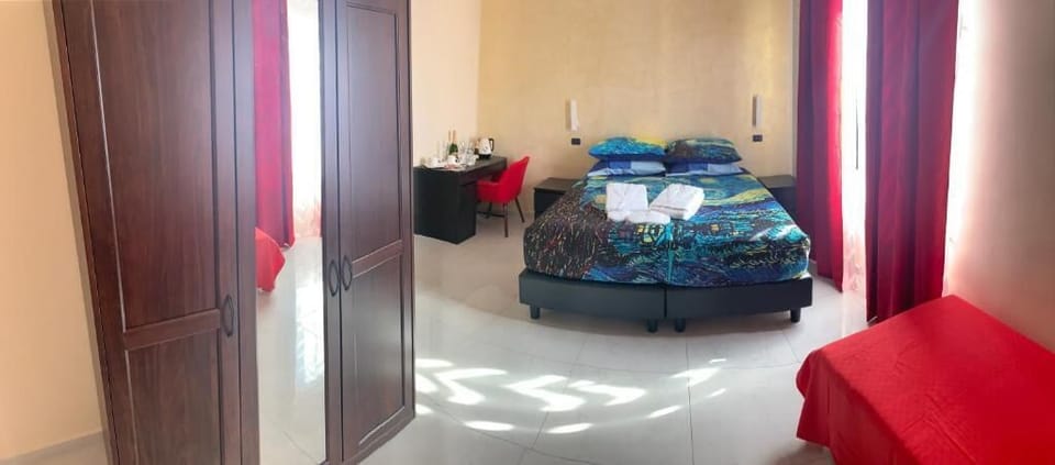 Family Triple Room, Balcony, Sea View | In-room safe, desk, laptop workspace, soundproofing