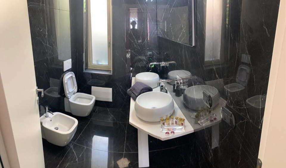 Family Triple Room, Balcony, Sea View | Bathroom | Shower, hair dryer, bathrobes, bidet
