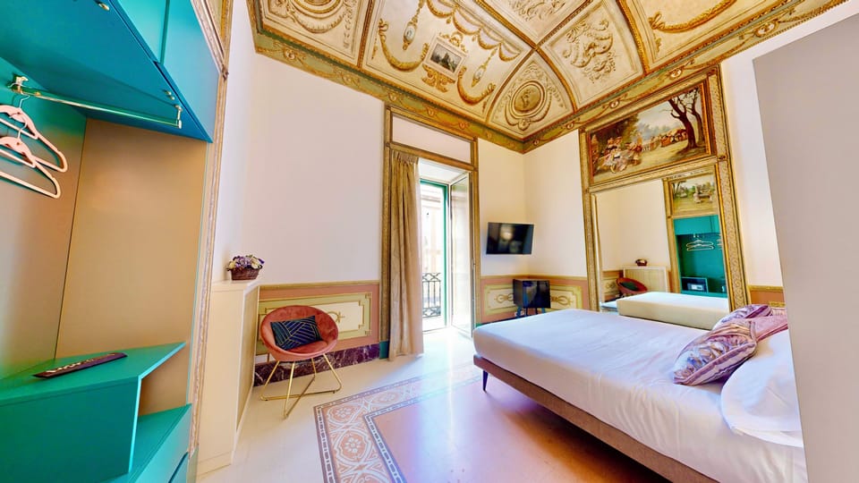 Deluxe Suite, Balcony, City View | Minibar, in-room safe, individually furnished, desk
