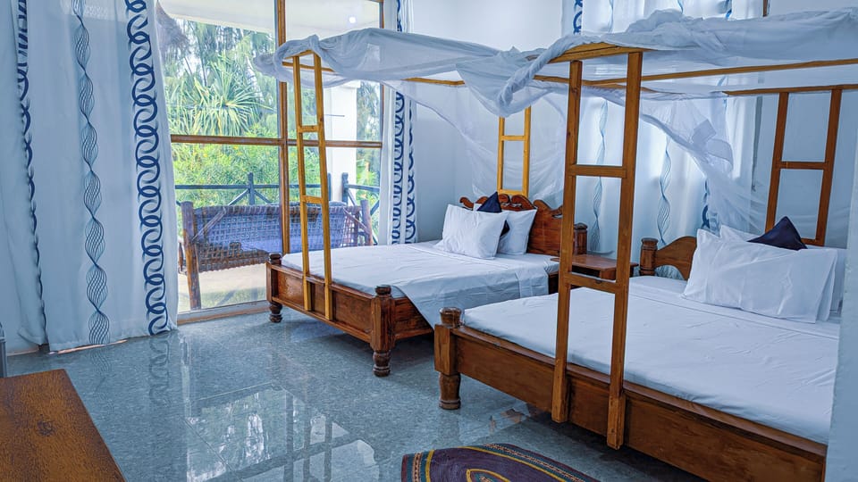Deluxe Quadruple Room, Balcony, Garden View | Desk