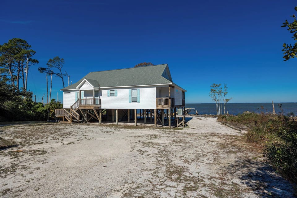 Enjoy stunning bay views from Bayside Bungalow, a bay front home located at 9531 State Hwy 180, Fort Morgan, Alabama