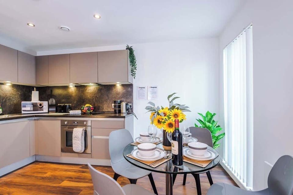 The open-plan living room, dining area and kitchen benefit from a comfortable sofa and 40-inch SMART TV.