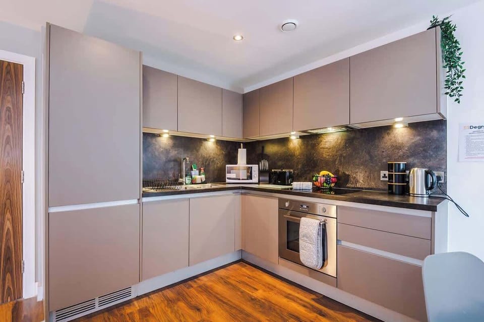 The fully equipped kitchen has everything you need for a short or long term stay whilst away in Manchester.