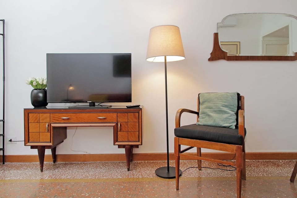 Apartment | Living area | 32-inch flat-screen TV with cable channels