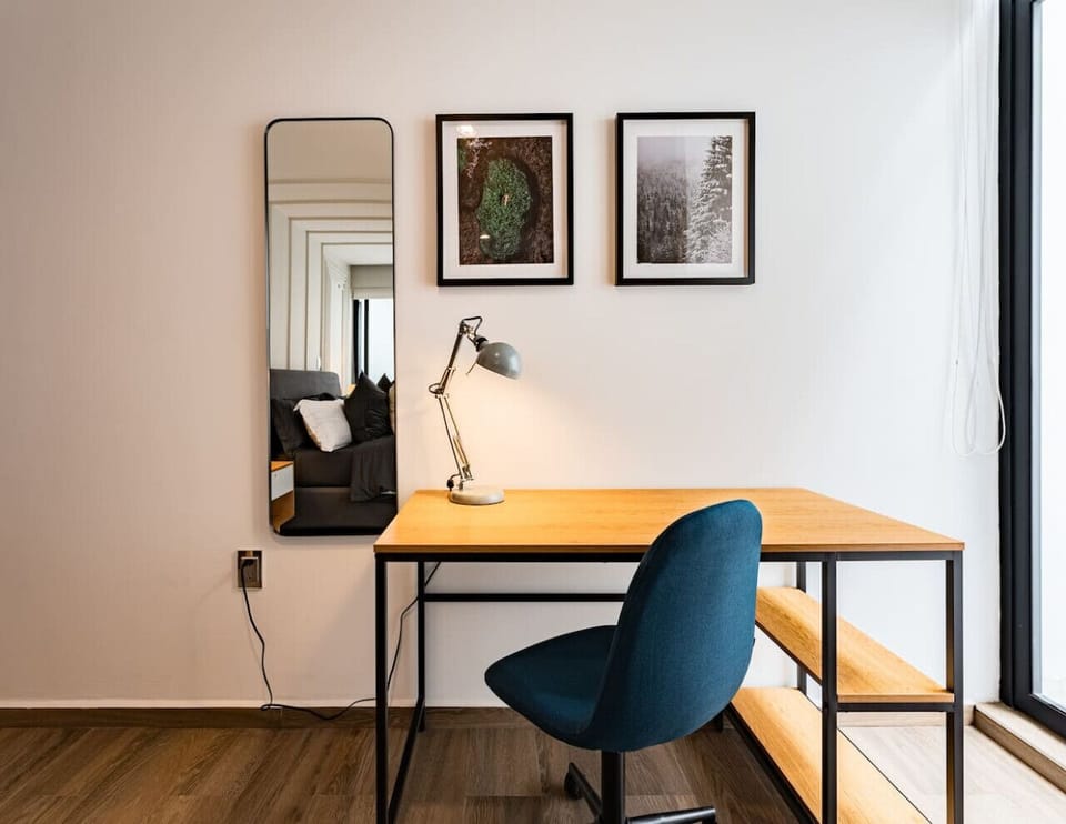 Work comfortably from a well-lit dedicated workspace with serene views