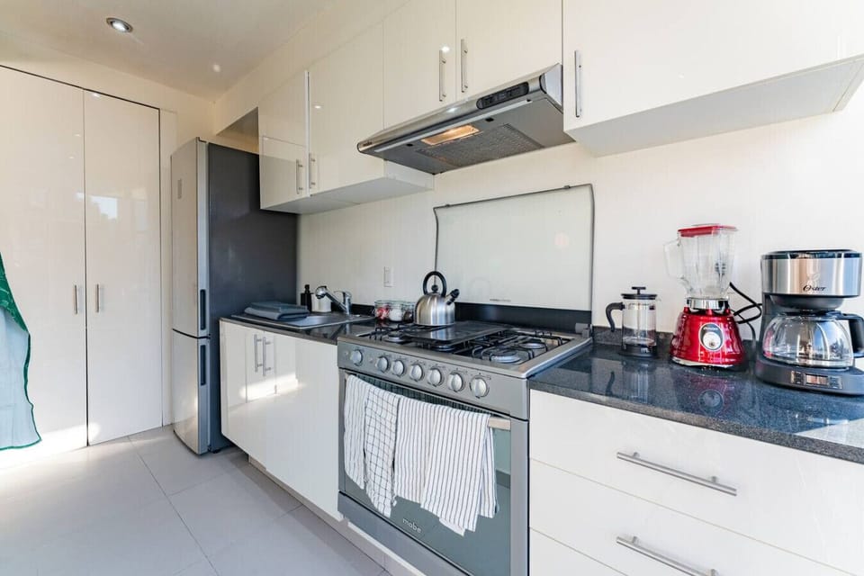 Sleek and modern kitchen for easy meal prep during your stay.