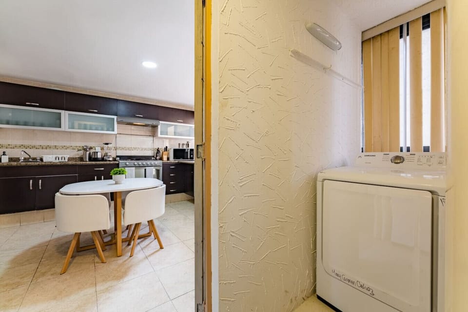 Bright, clean laundry room with everything you need for a hassle-free stay.