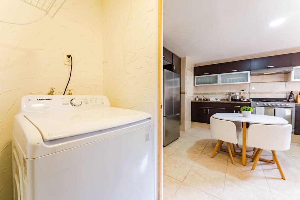 Fully equipped kitchen and convenient laundry area, ready for your stay.