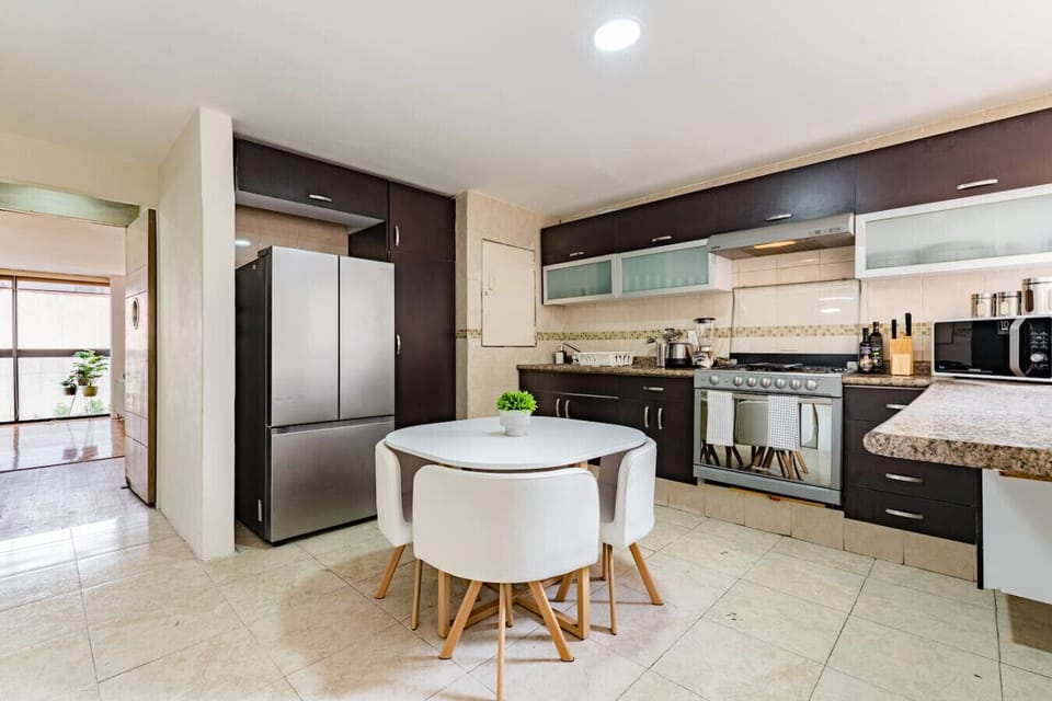 Modern kitchen with sleek appliances, ready for your next home-cooked meal