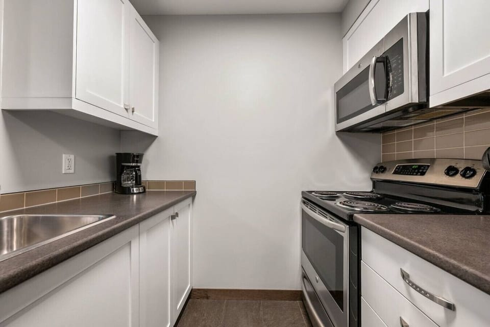 Full kitchen with a drip coffee maker, ground coffee, tea, sugar and basic condiments (ketchup/mustard/relish.)
