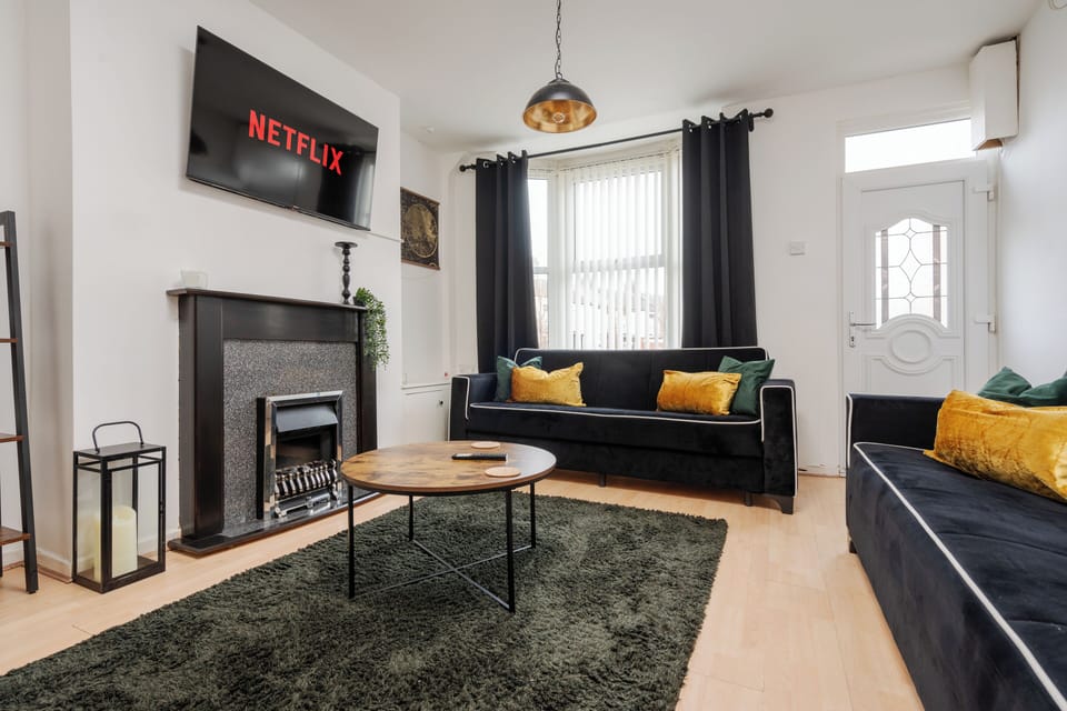 A bright and comfortable living space with spacious seating and a Smart TV with Netflix — the ideal spot to relax after the excitement of match day at Anfield Stadium, just a short walk away