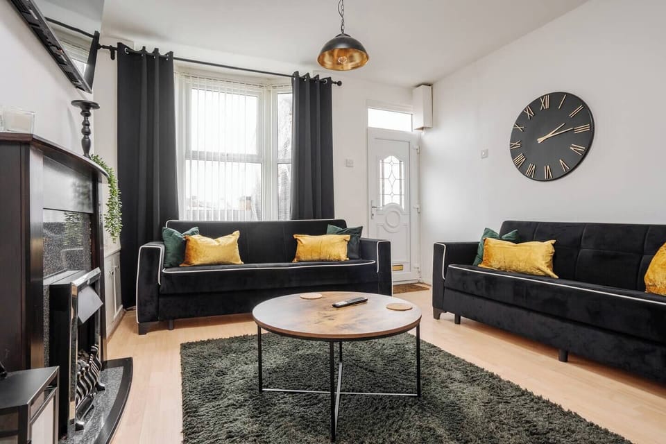 A bright and comfortable living space with spacious seating and a Smart TV with Netflix — the ideal spot to relax after the excitement of match day at Anfield Stadium, just a short walk away