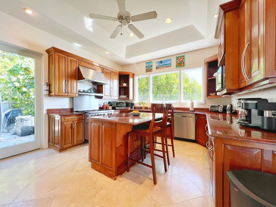 A kitchen so sleek, you might actually enjoy doing the dishes. The professional gas range will be a private chef's dream.