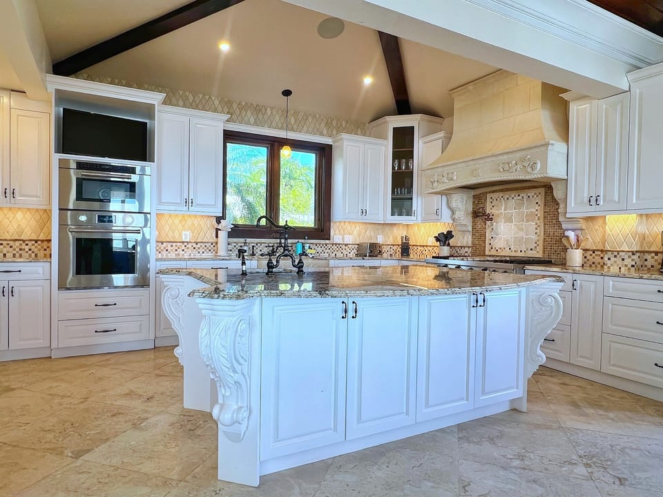 Double ovens and expansive counters cater to every culinary need.