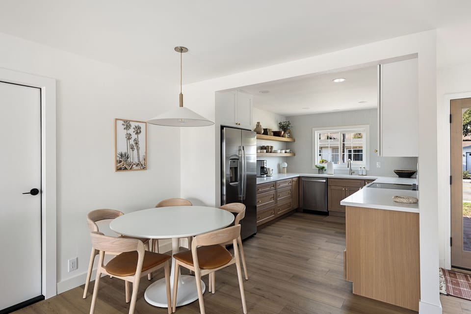Dinning table with 6th chair at desk to use as needed.