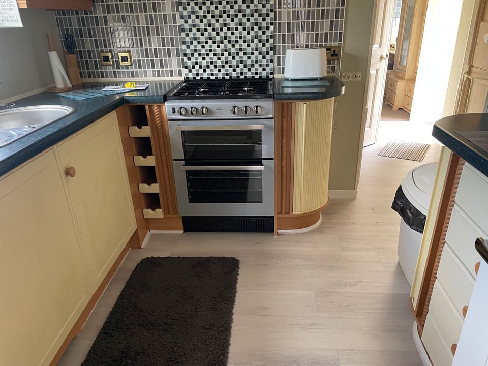 Modern Kitchen With Range Cooker 
Freezer 
Family Size Fridge 