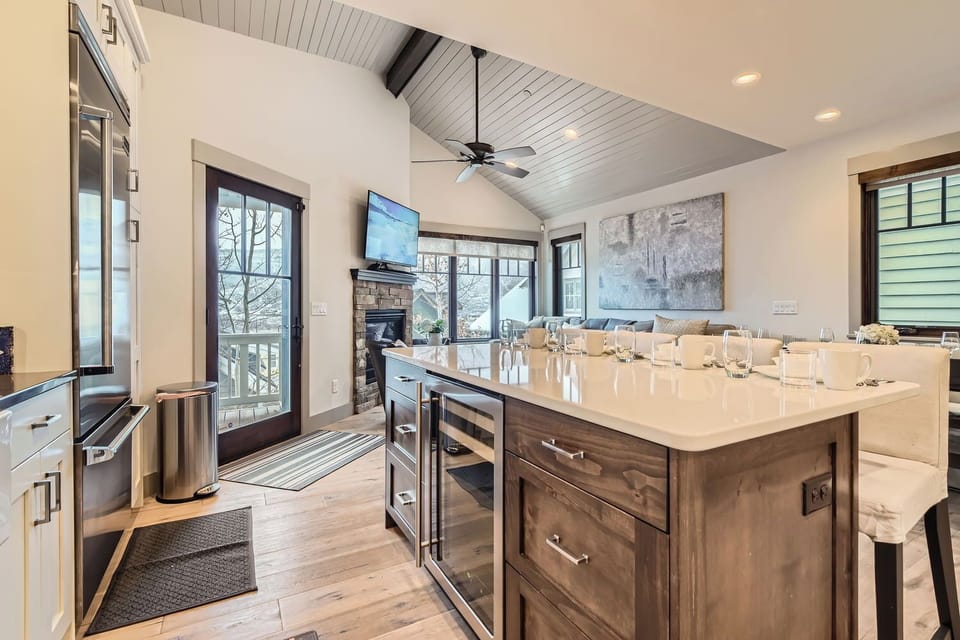 Whip up a gourmet meal in the chef's kitchen featuring high-end appliances, a spacious island, and all the cooking essentials for your Park City getaway.