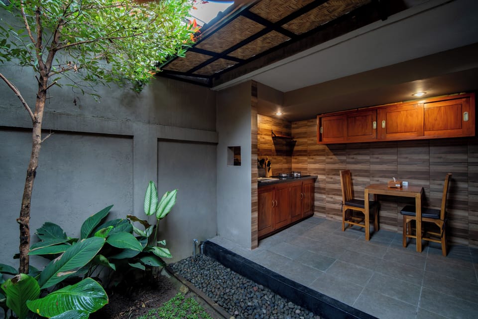 Luxury Villa, Patio, Garden View | Private kitchen | Mini-fridge, stovetop, cookware/dishes/utensils, dining tables