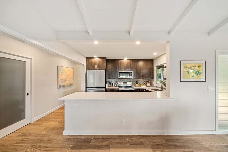 Experience convenience in a modern kitchen with spacious countertops and updated design.