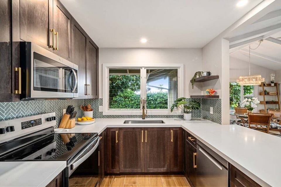 Cook in style with a sleek kitchen featuring premium finishes and natural light.
