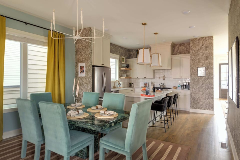 This open-concept layout ensures both functionality and style, allowing for easy communication between the kitchen and dining area while creating an inviting space for social gatherings.