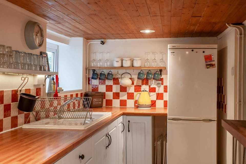 Please note, the kitchen has a low ceiling.