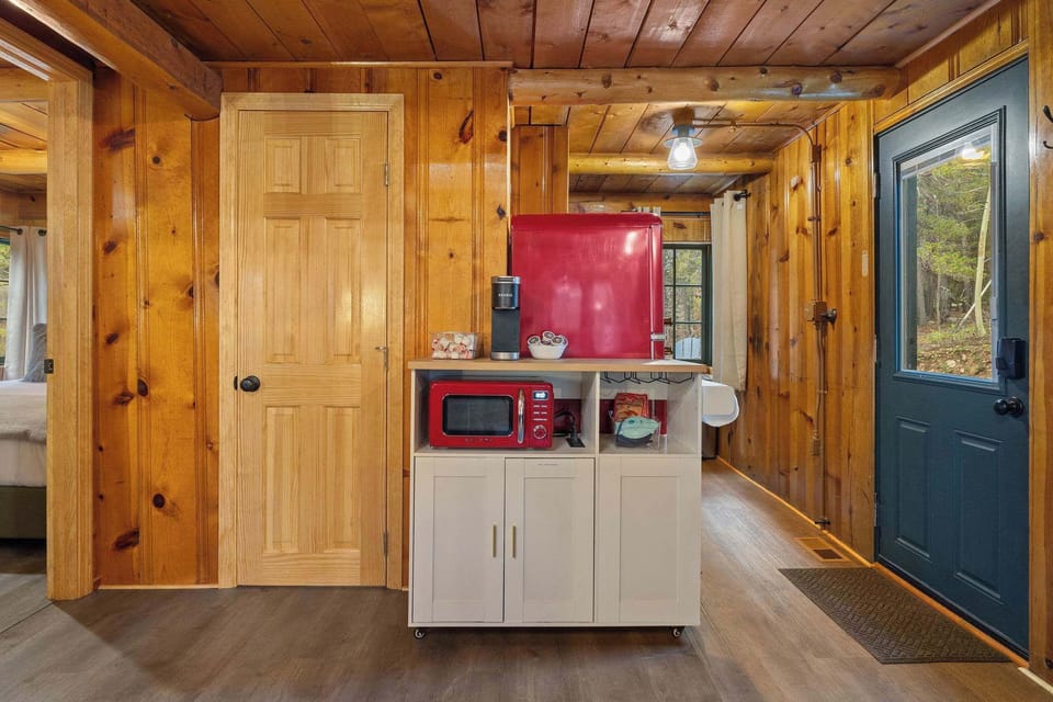 The kitchen is to your right when you enter the door, the Queen bedroom is on the far left of the photo and the bathroom is in the middle. 