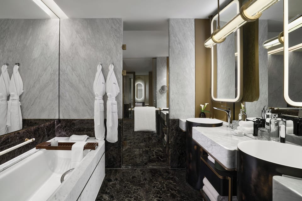 Separate tub and shower, rainfall showerhead, designer toiletries