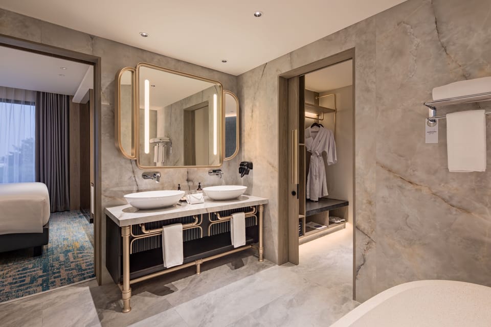 Suite, 1 Double Bed | Bathroom | Free toiletries, hair dryer, slippers, towels