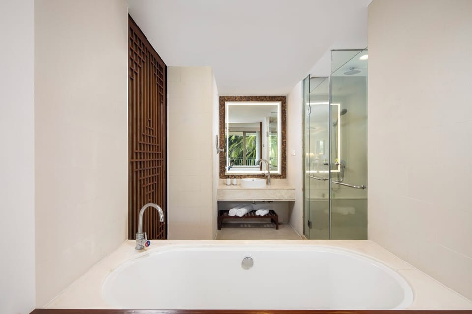 Separate tub and shower, rainfall showerhead, hair dryer, bathrobes