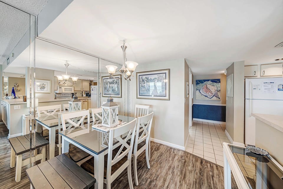 There is a large dining table, perfect for enjoying a meal or playing a game.