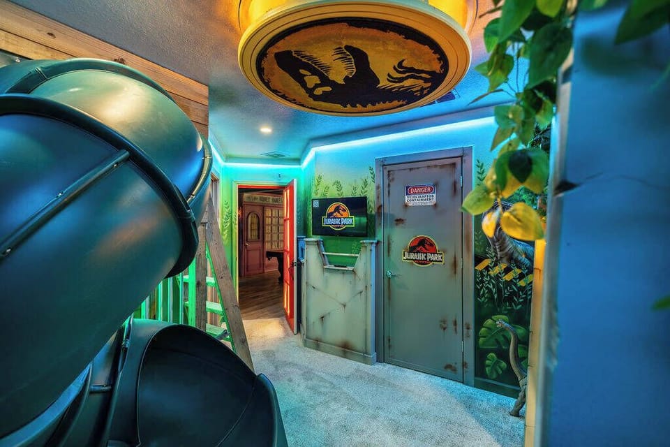 Step into a vibrant hallway adorned with playful lighting and themed decor that invites you in. The stunning ceiling fixture and colorful accents ignite your sense of adventure, inviting you to discover this home's unique spaces.