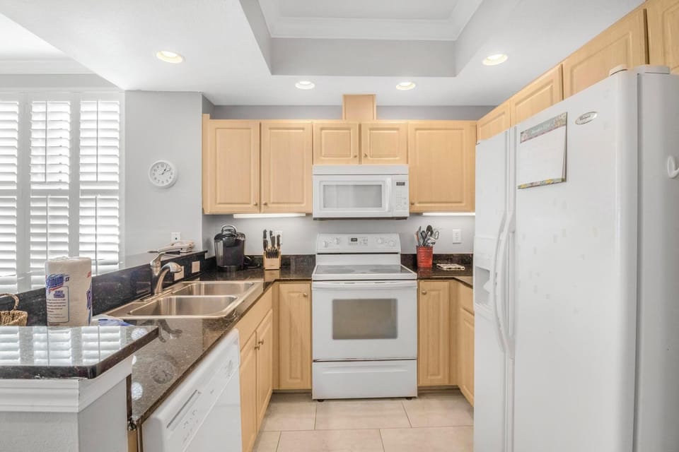 Kitchen is stocked with pots/pans/utensils