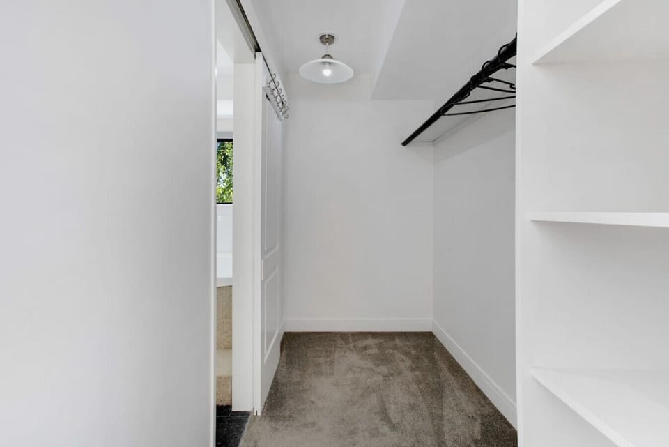 There is a walk-in wardrobe from the main bedroom.