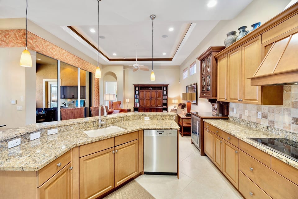Sleek stainless steel kitchen with premium appliances and dual-zone wine fridge