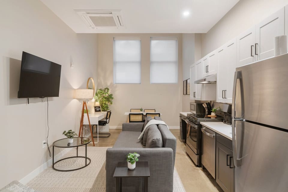 You feel at home as you settle into the living room, where the inviting atmosphere is perfect for lounging or entertaining.