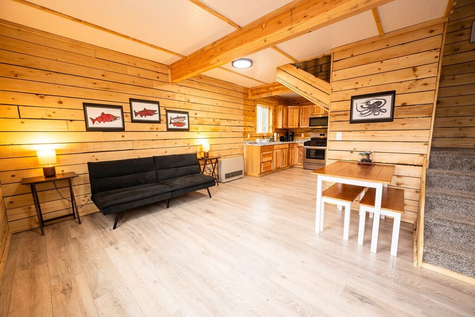 Open living, kitchen, and dining area with natural wood details and plenty of space to unwind.