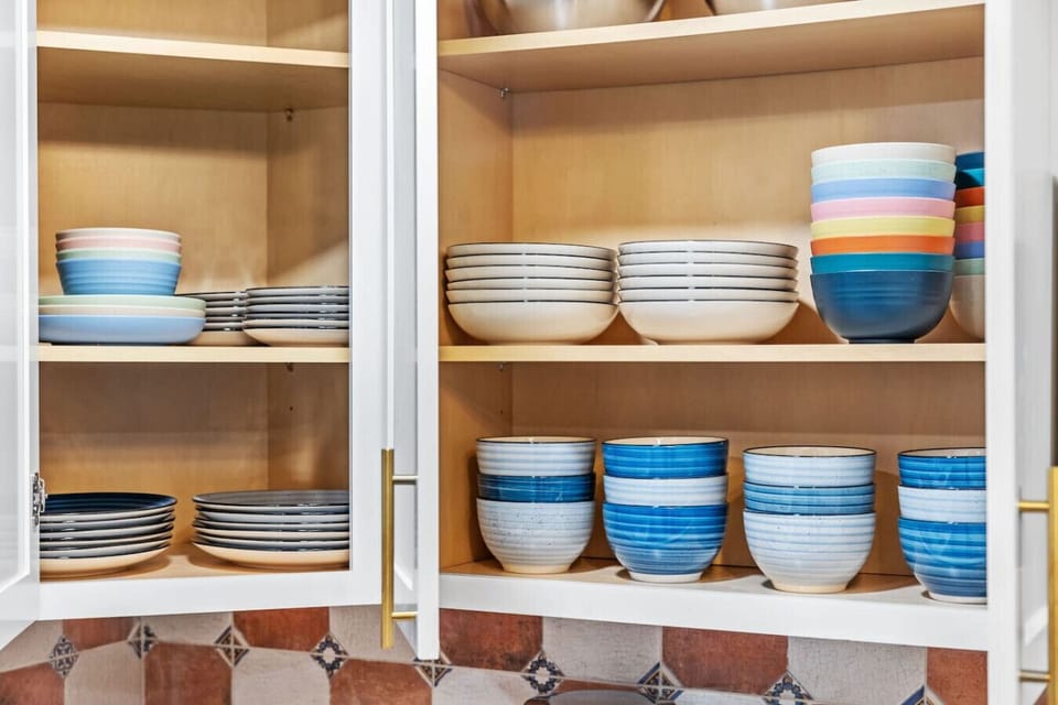 Open + Organized – Fully-stocked shelves reveal a thoughtful collection of dishware in every hue, for every meal, for every age.
