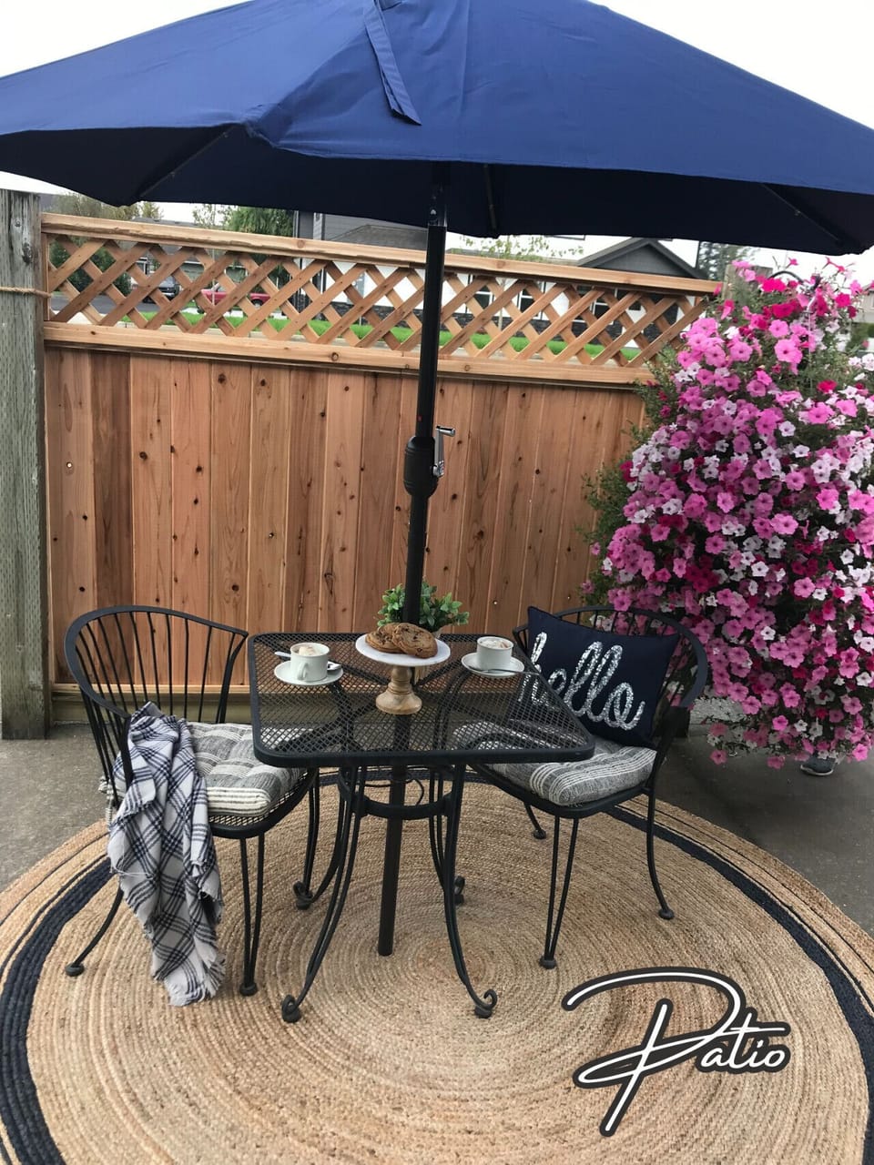 A private outdoor retreat with café seating, shade, and floral touches—ideal for enjoying peaceful mornings or relaxed evenings.