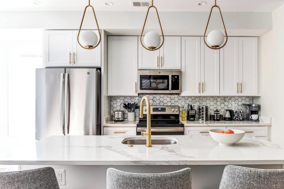 Cook, dine, and connect in this sleek and functional kitchen
