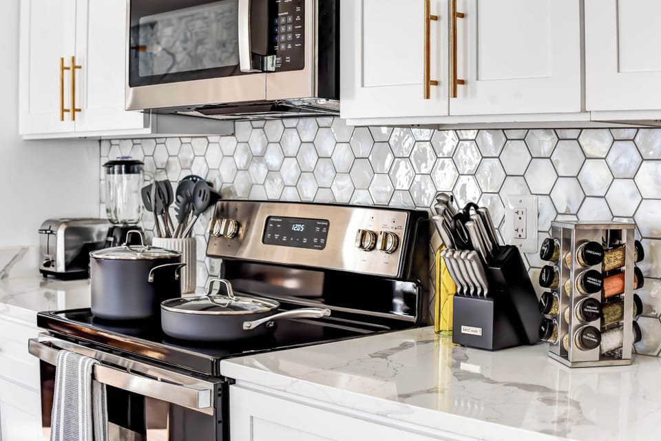 Whip up your favorite meals in this modern kitchen with all the essentials you need