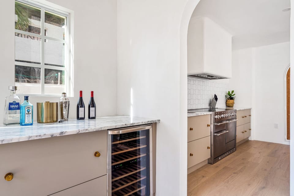 This wine cooler and wet bar area is right