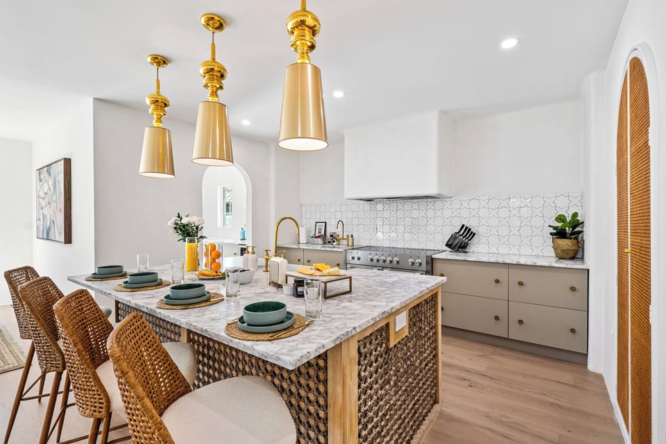 Enjoy a brand-new kitchen with Carrara Venato Marble countertops.