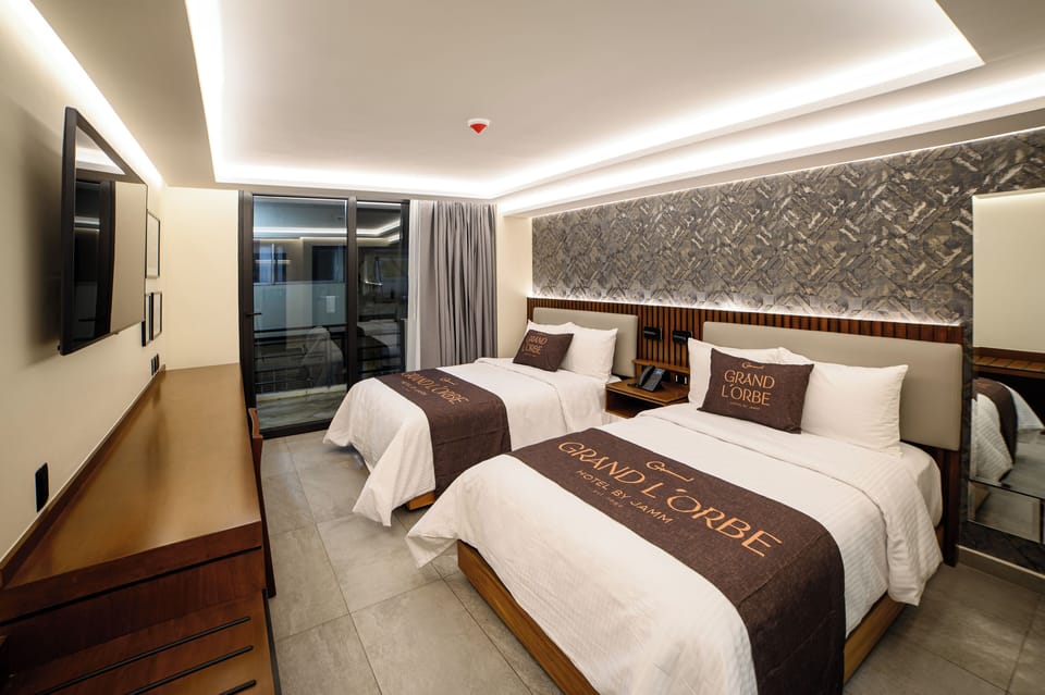 Deluxe Room, Balcony, City View | In-room safe, desk, laptop workspace, blackout drapes