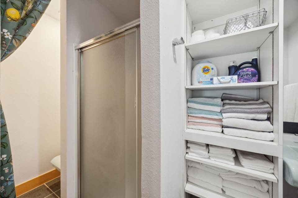 Another view of the bathroom with a shower.